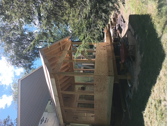 Side framing view of the Bedford four-season porch addition tied into the rebuilt deck