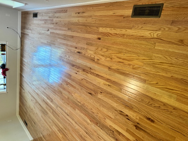 Room view of newly installed hardwood flooring in Merrimack